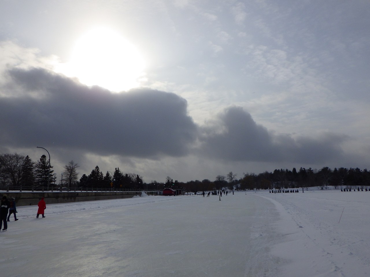 Skaters gliding along the frozen Rideau Canal in Ottawa, the world's largest skating rink