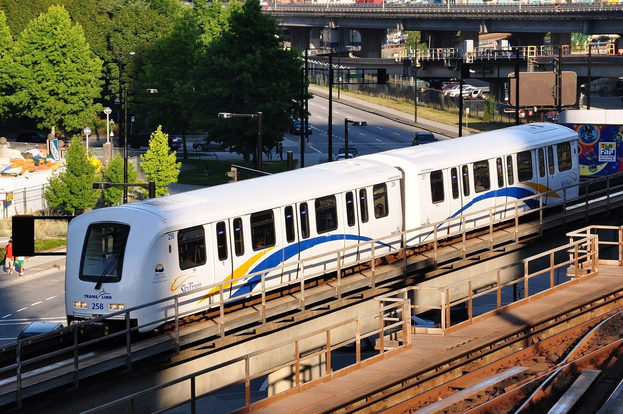 A Vancouver SkyTrain elevated train gliding past on its track