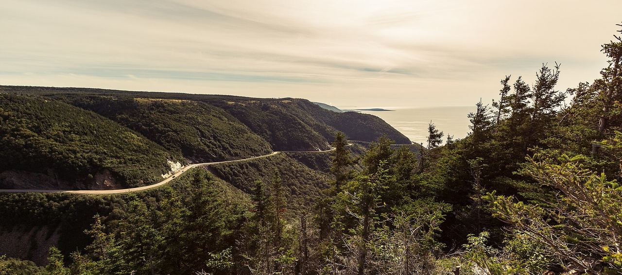 The Cabot Trail winding along the coastline of Cape Breton, Nova Scotia