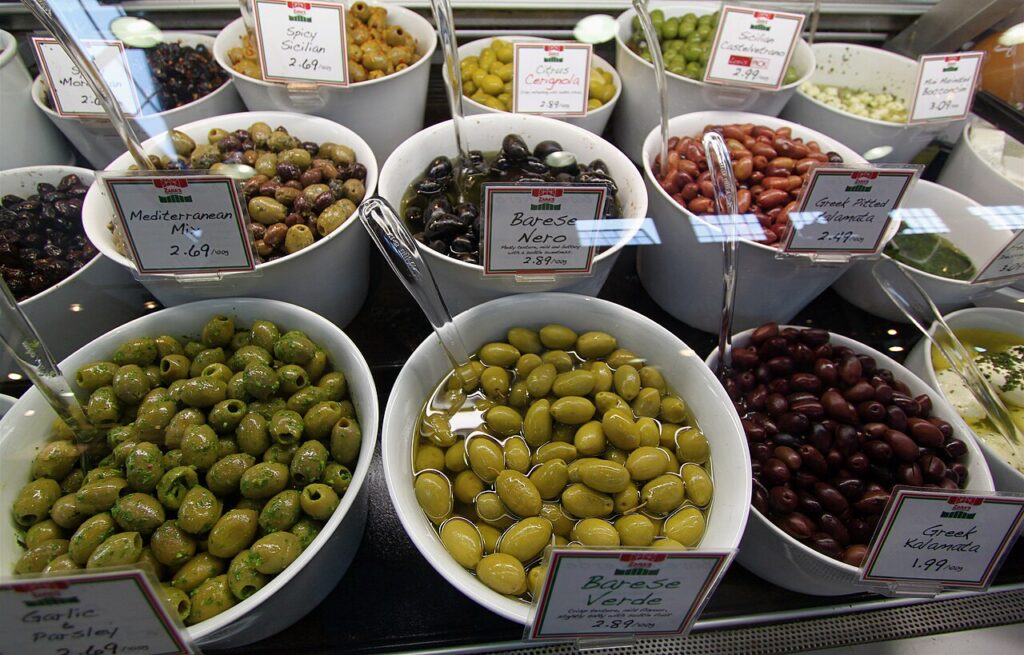 Bowls of olives and fresh produce at Granville Island Public Market