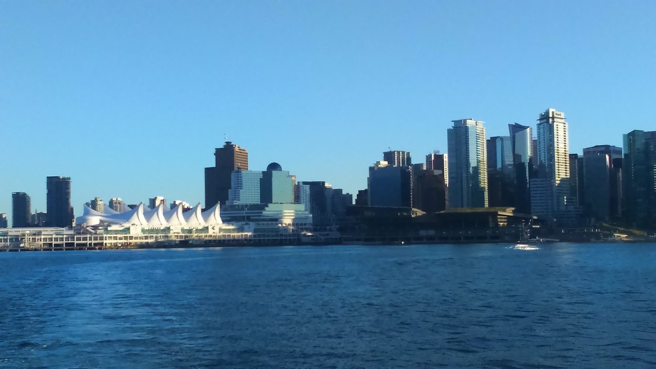 Canada Place sails with the downtown Vancouver skyline across the harbour