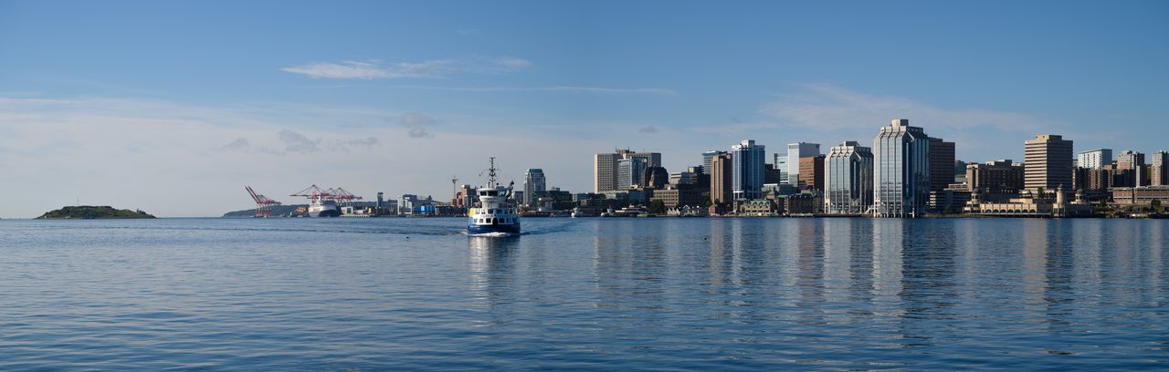 Wide-angle view of the Halifax skyline and harbour from across the water
