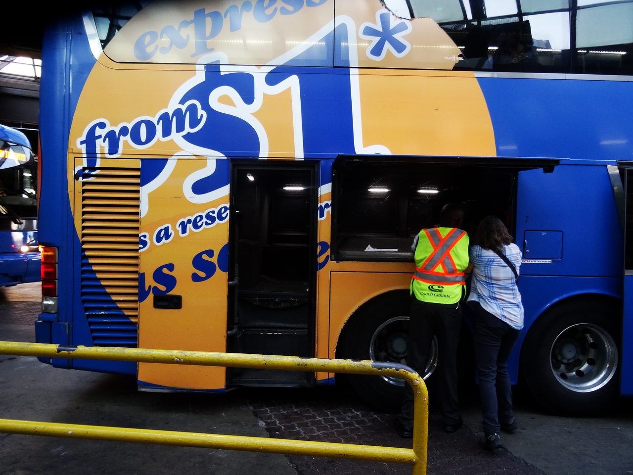 Blue double-decker Megabus coach at a bus station, a mainstay of Ontario and Quebec intercity routes