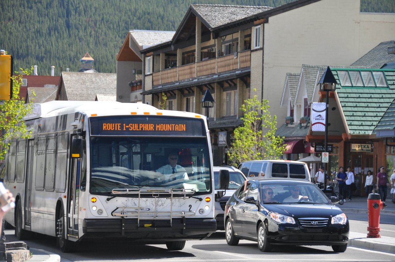White Roam public transit bus on Route 1 to Sulphur Mountain in Banff, Alberta