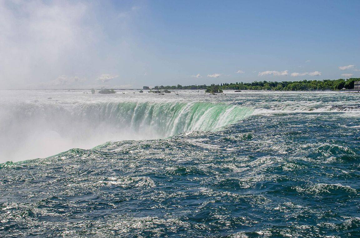 Horseshoe Falls thundering over the crest, viewed from the Table Rock Centre in Niagara Falls, Ontario