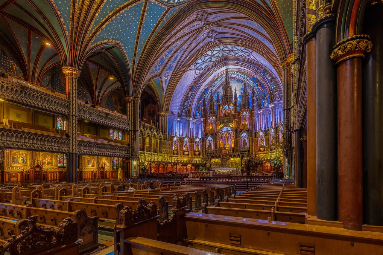 The glowing blue and gold nave of Montreal's Notre-Dame Basilica