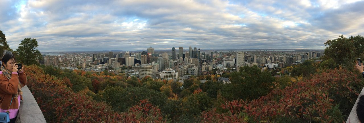 Kondiaronk Lookout terrace on Mount Royal with fall foliage and the Montreal skyline beyond