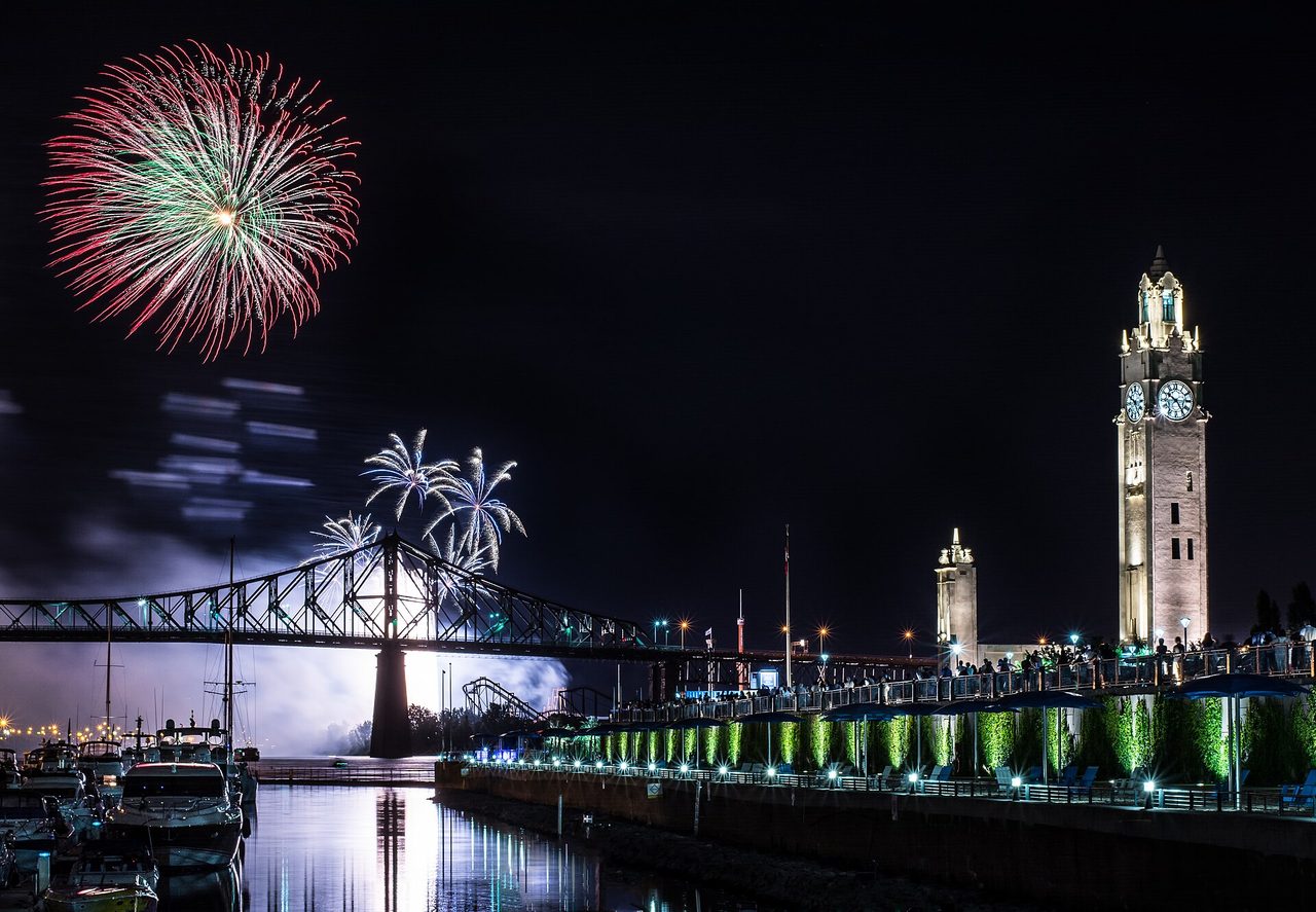 Fireworks bursting over the Montreal Clock Tower during L'International des Feux Loto-Québec