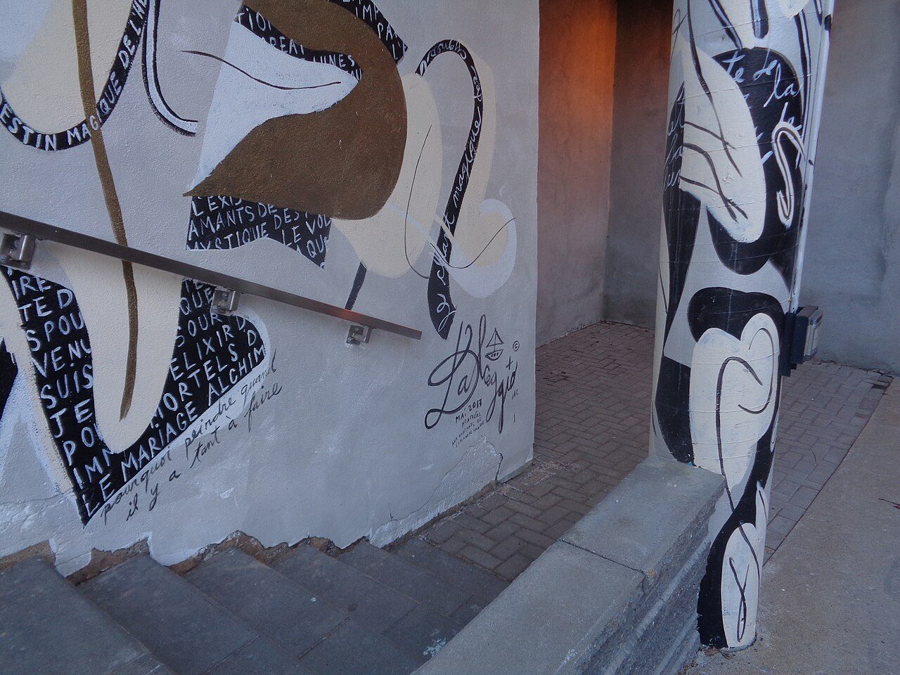 Large colorful street art mural 'L'anatomie de l'invisible' created for Montreal's MURAL Festival