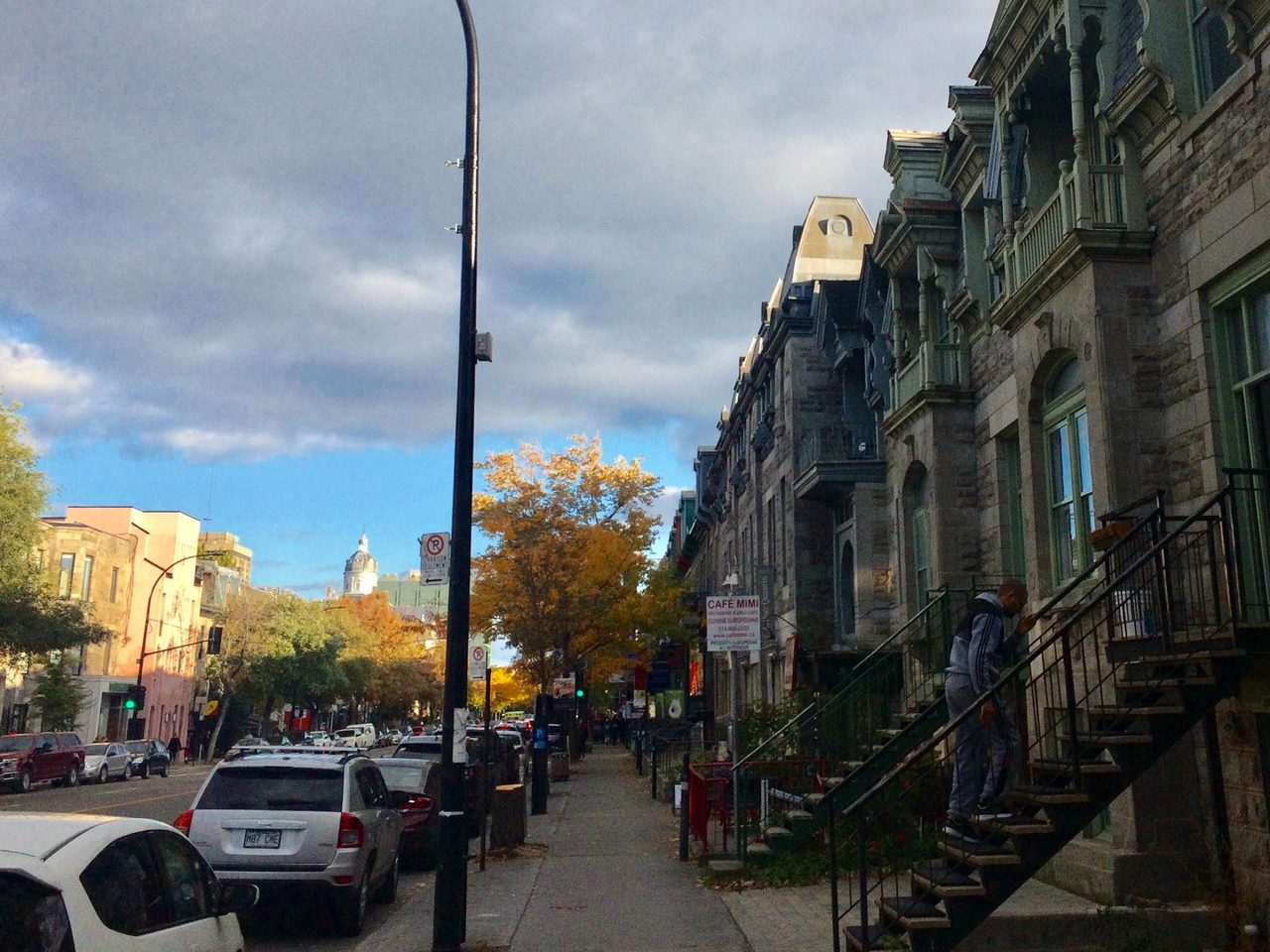 Colorful Plateau-Mont-Royal houses with exterior staircases on a residential street
