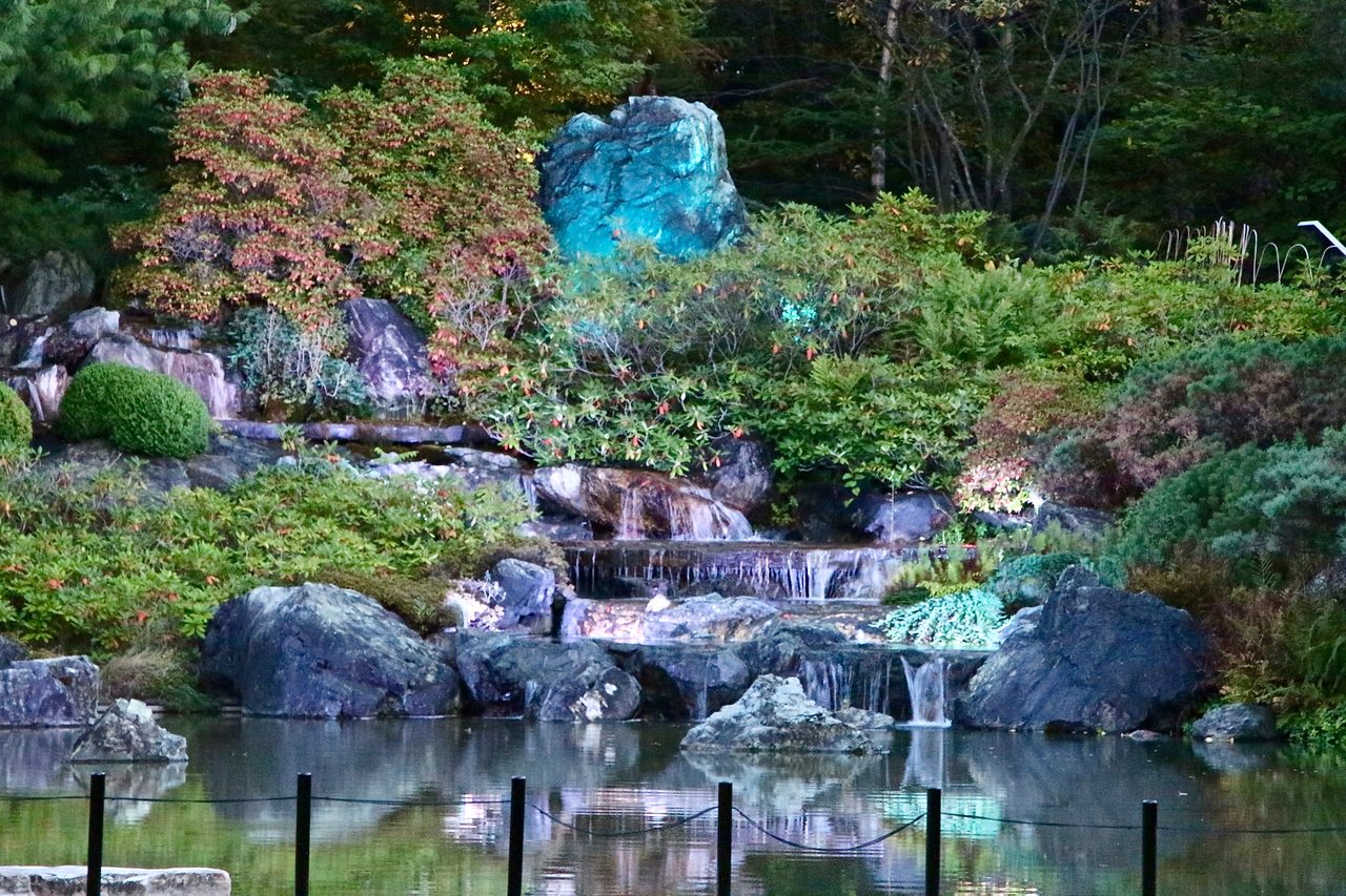 Wooden bridge over a koi pond in the Japanese Garden at the Montreal Botanical Garden