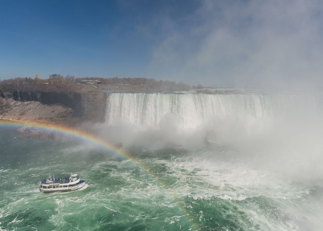 Maid of the Mist boat approaching Horseshoe Falls in heavy mist at Niagara Falls