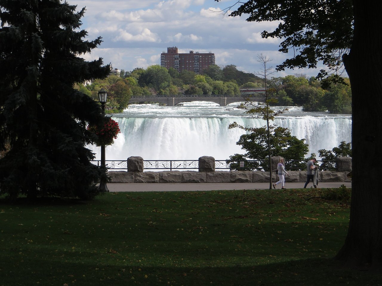 American Falls cascading over the rock face with Luna Island trees above, Niagara Falls State Park