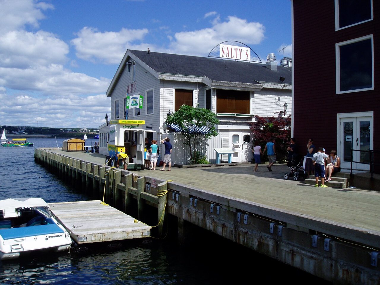 Halifax waterfront boardwalk with historic buildings and harbour boats