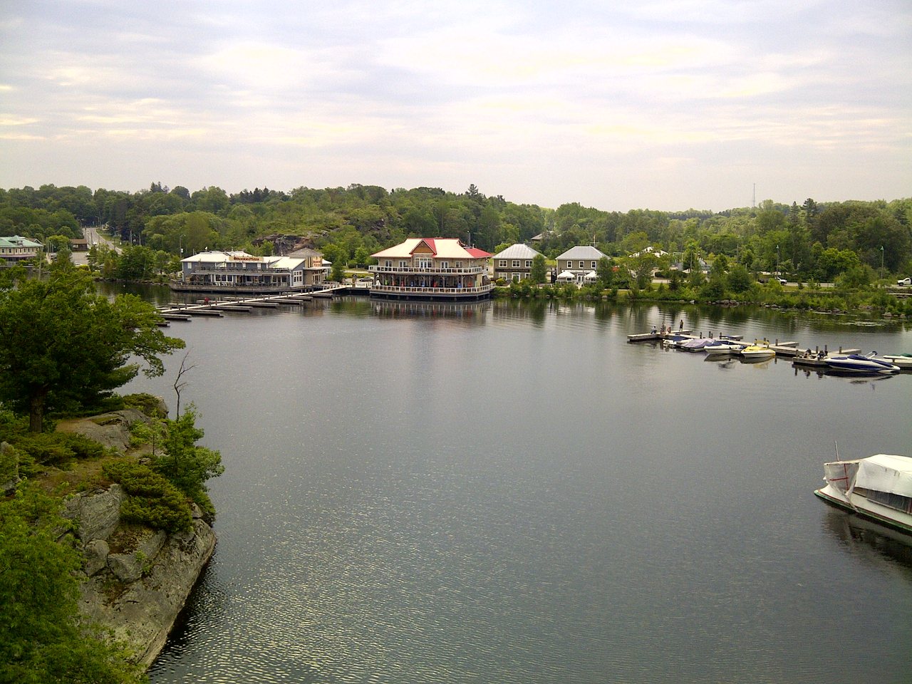 Calm blue water and forested shoreline of Muskoka Bay near Gravenhurst, Ontario