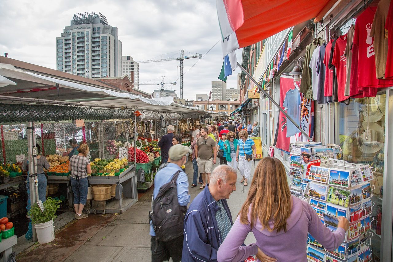 Produce stalls and shoppers crowding the outdoor street market in Ottawa's ByWard Market district