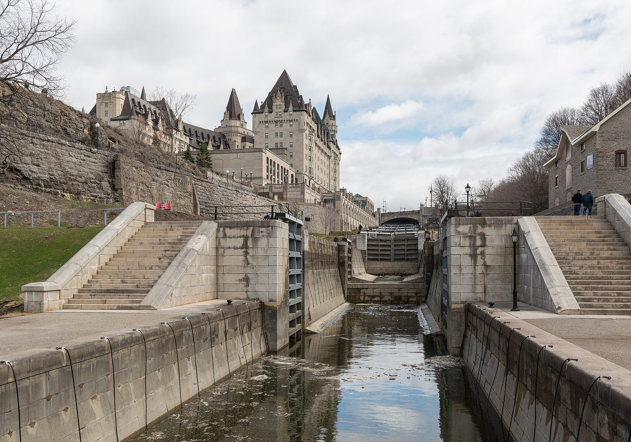 The historic Rideau Canal locks in downtown Ottawa with the Fairmont Chateau Laurier rising above them