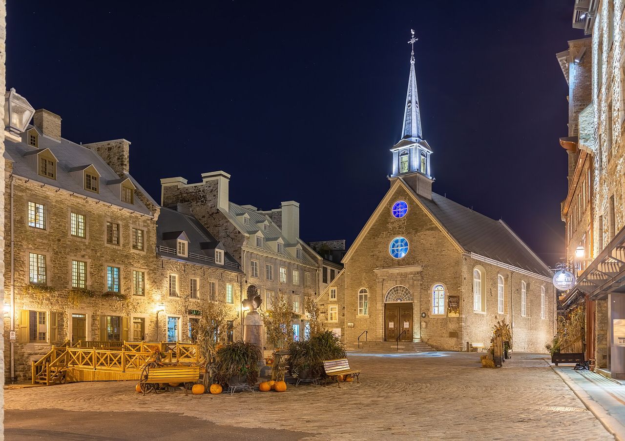 Place Royale square and Notre-Dame-des-Victoires church glowing at night