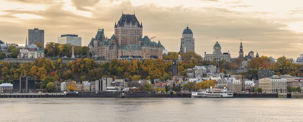 Quebec City skyline with Château Frontenac and fall colours, viewed across the St. Lawrence River from Lévis