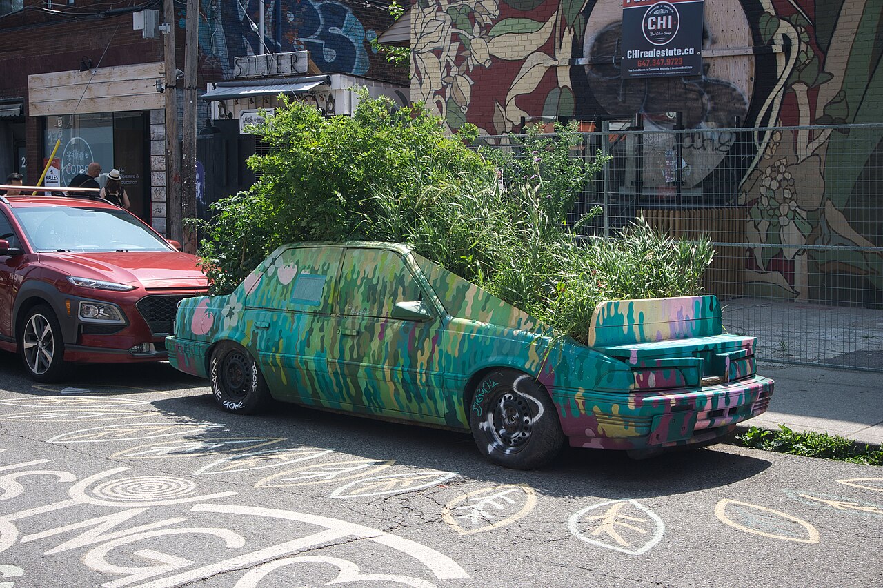 Garden car decorated with plants on a colourful street in Kensington Market