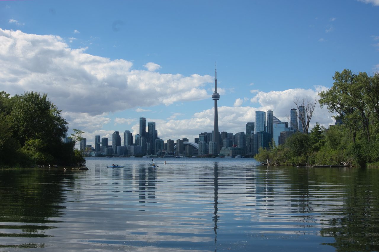 Toronto's skyline seen across the water from a viewpoint on the Toronto Islands