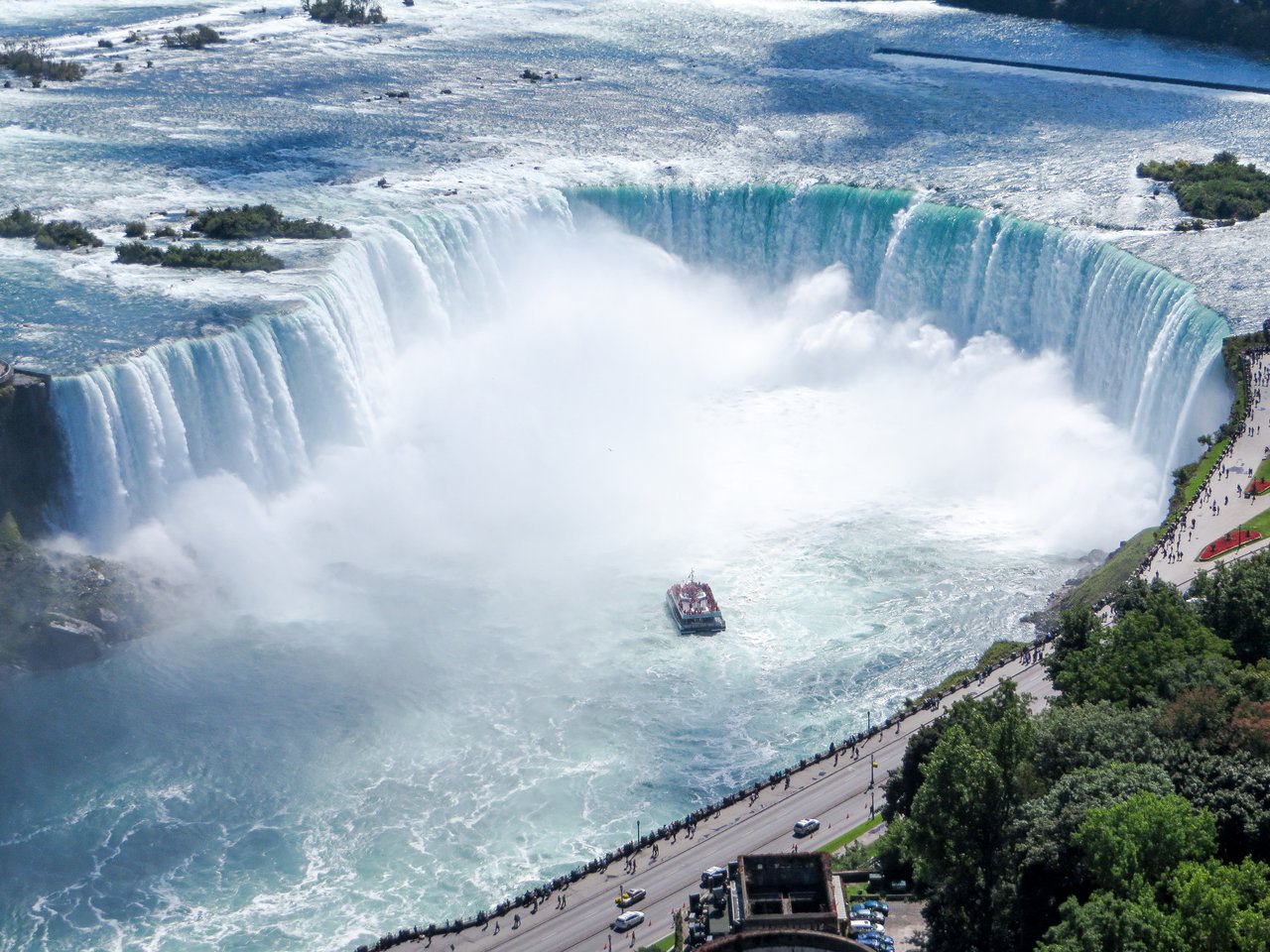 Aerial view of Horseshoe Falls with a tour boat approaching the mist at Niagara Falls