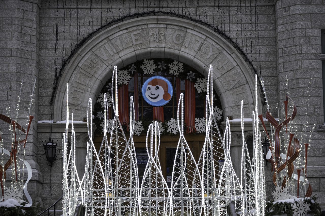 Québec City Hall decorated with Bonhomme Carnaval winter decorations and lights