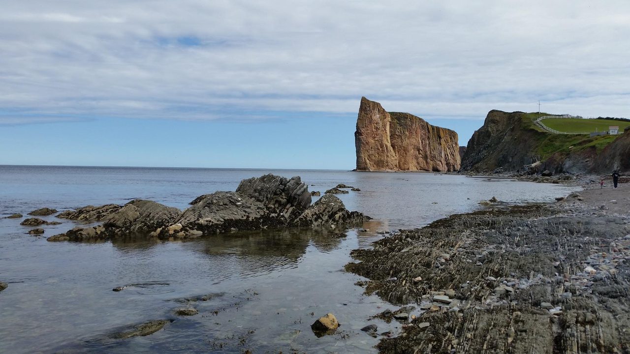 Percé Rock rising from the Gulf of St. Lawrence at the tip of the Gaspé Peninsula