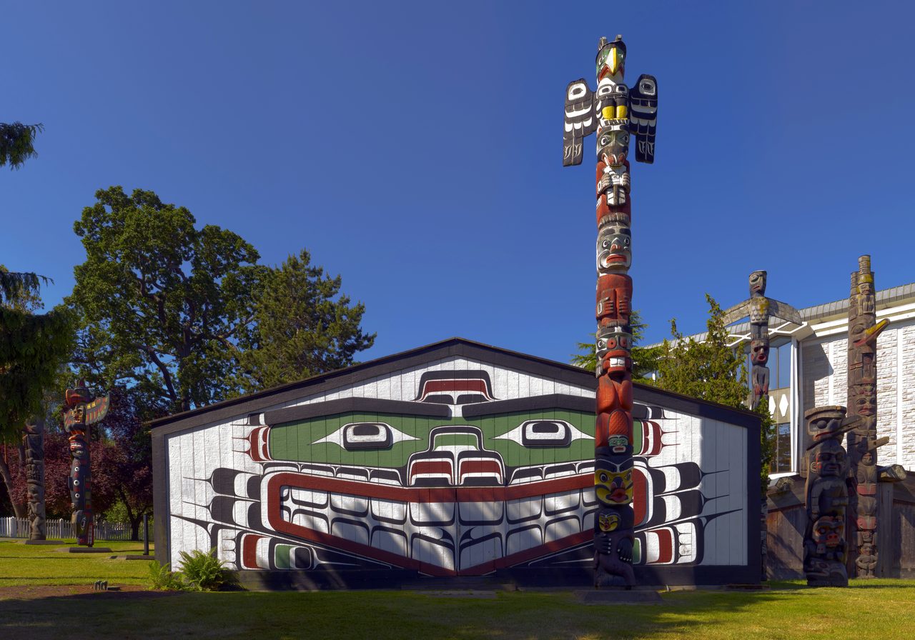 Totem poles and the Mungo Martin House (Wawadit'la) at Thunderbird Park beside the Royal BC Museum