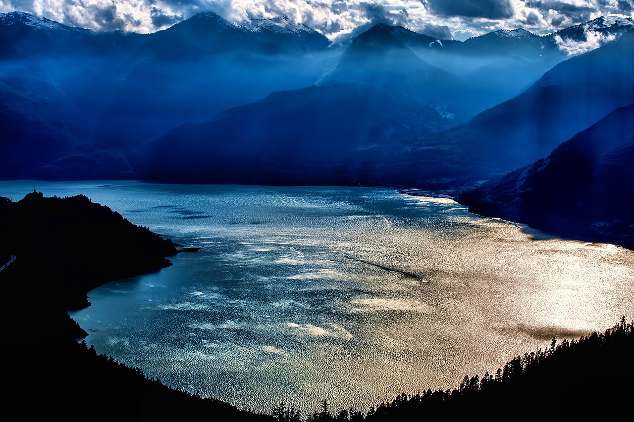 View from the Sea to Sky Gondola over Howe Sound and layered blue mountains